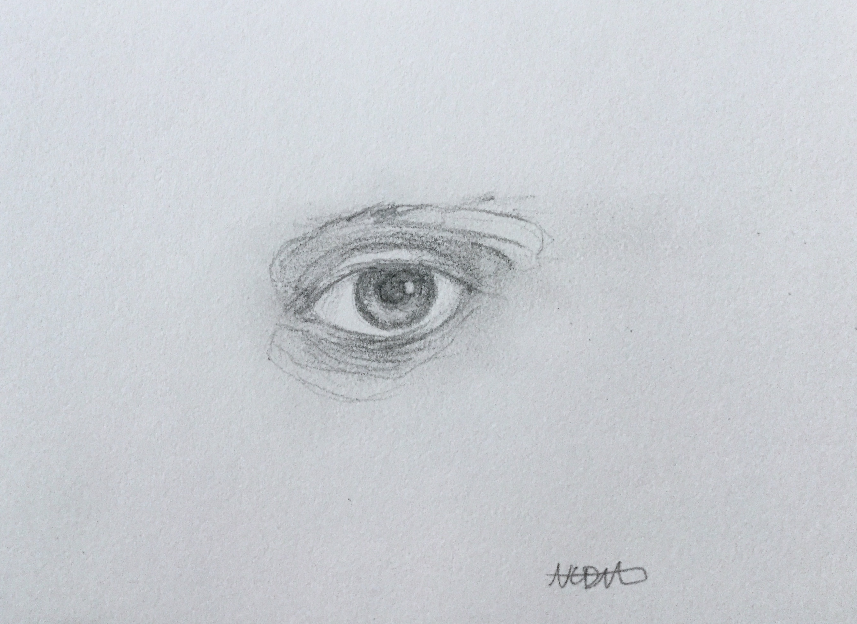 Small graphite drawing of an eye.